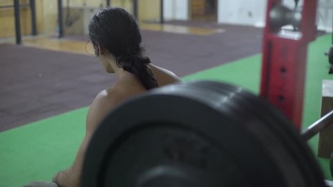 Barbell training in gym