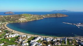 Aerial drone video of beautiful sandy beach of Livadi with deep turquoise sea in island of Serifos at spring, Cyclades, Greece