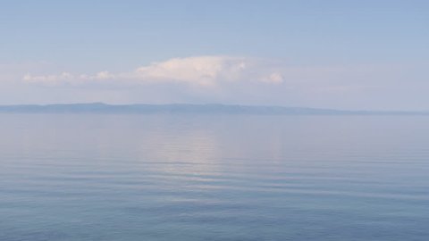 beautiful panorama of the calm blue surface of the waves and the quiet of the huge lake Baikal