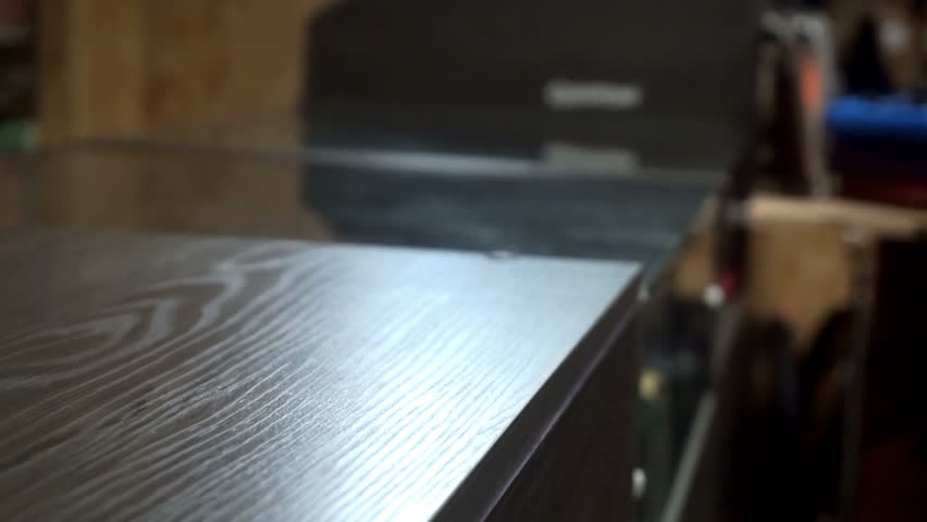 Man knocks on the counter in the store close up