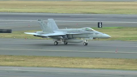 US Navy F-18 Hornet Blue Blaster Squadron taxies runway, sound, Logan Airport Boston Massachusetts USA, September 6, 2014
