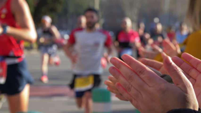 Diverse and Colorful Marathon. People Applauding the Runners. Slow Motion. | Shutterstock HD Video #1025104604