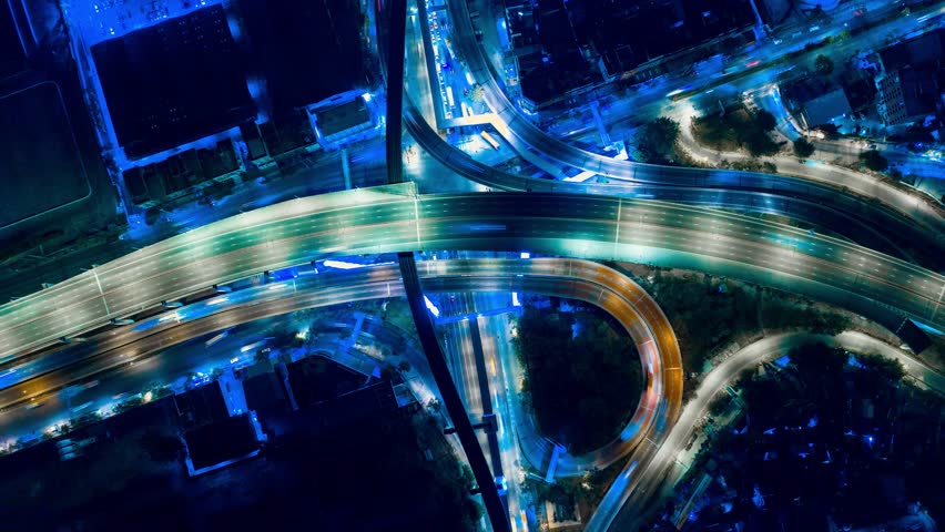 Hyper Time Lapse of Aerial View of Busy Highway Road Junctions at Night from a drone. The Intersecting Freeway Road Overpass The Eastern Outer Ring Road. | Shutterstock HD Video #1025109122
