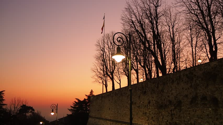 Bergamo, Italy. The old town. Fiery sunset along the ancient Venetian wall