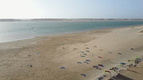 Drone footage of kitesurf kites laid out on the beach in Dakhla, Morocco