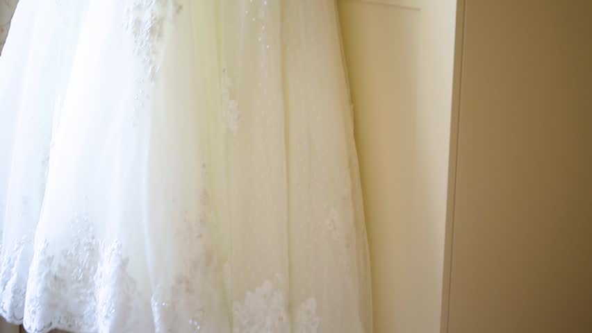 Bride Dress Hung On The Wardrobe Before The Wedding.
