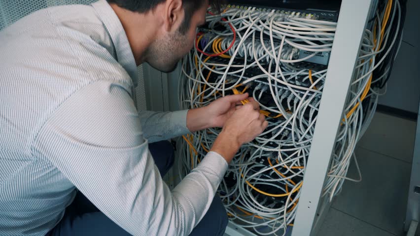 engineer patching network equipment server room Stock Footage Video ...