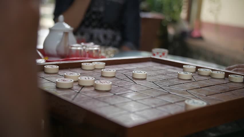 Tra Vinh, Vietnam - 11 30 2018: elderly males playing Chinese chess, Vietnam