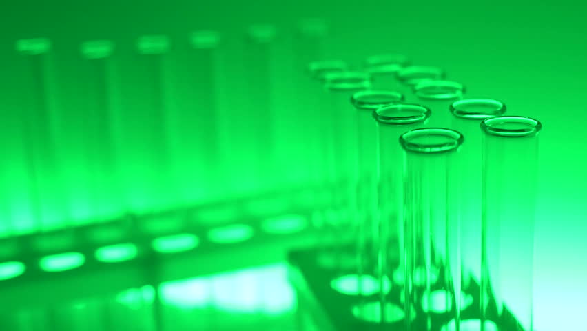 Glass test tubes in laboratory with green light. Close up 4K footage. Vaccine searching.  Research on a new drug. Cosmetic creating. | Shutterstock HD Video #1025120276