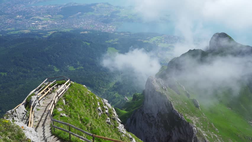 Man Walking Down the Stairway of the Summit of Mount Pilatus, Switzerland