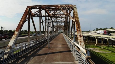 Drone Footage Flying Along the Bevil Jarrell Walking Bridge over the San Jacinto River in Humble, Texas next to Hwy 59/I-69 in North Houston