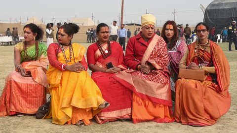 Allahabad / India 14 January 2019 Group of holy sadhu Hijra or third gender sitting on chairs at Prayagraj Kumbh Mela in Allahabad Uttar Pradesh India