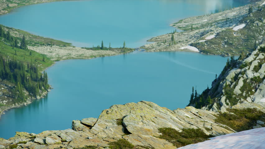 Lake view Heli hiker female young Caucasian traveler hiking in scenic mountains near glacial lake Canada RED MONSTRO