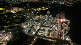 Aerial drone night video of petrochemical industrial complex with oil refinery in area of Elefsina, Attica, Greece