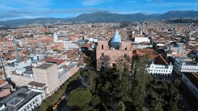 Aerial shots showing off the beautiful catholic churches and unique colonial architecture of Cuenca, Ecuador.