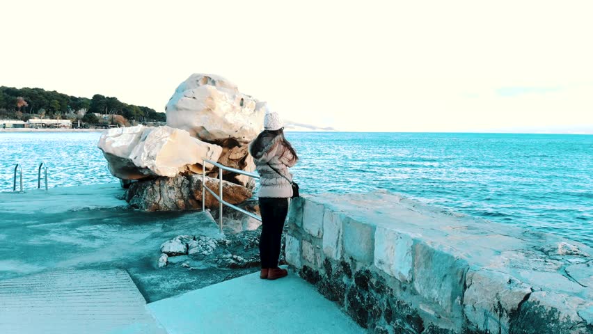 Girl is looking to the sea
