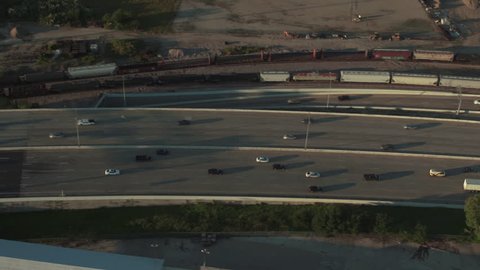 Aerial view of cars and trucks driving on a busy highway 35W and highway 30, in Dallas Texas at sunset. : stockvideo