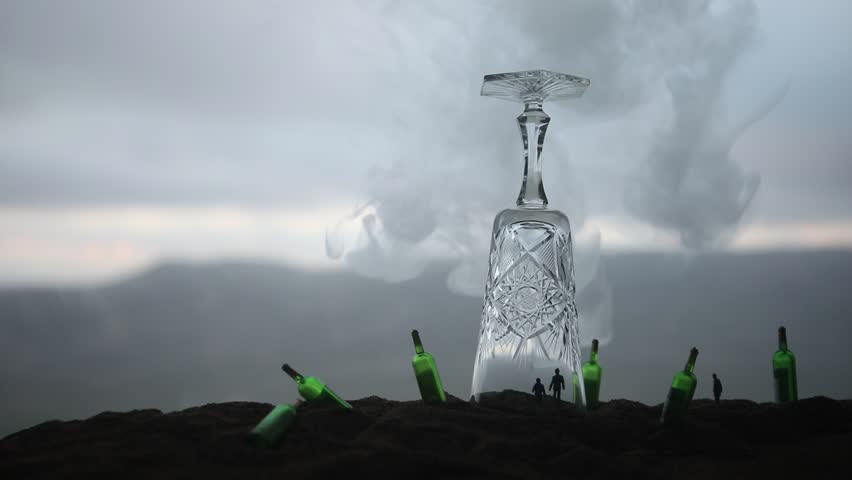Abstract alcoholism concept. People in under a giant glass like in prison. Creative artwork decoration. Selective focus