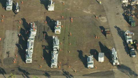 Aerial view of Utility service emergency truck depot and FEMA supplies near where the eye of the Hurricane came on shore Florida America RED WEAPON