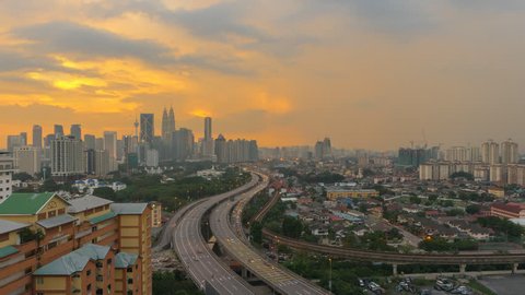 Time Lapse: Day to night of cityscape (Kuala Lumpur) during hazy sunset in Malaysia. 