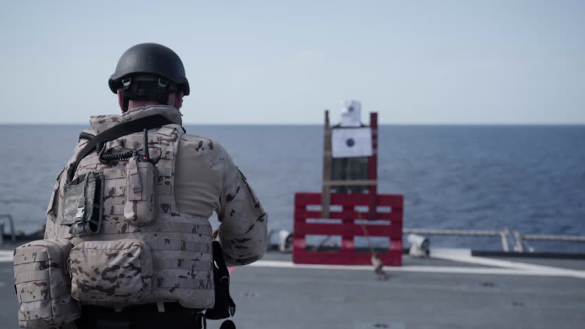 Military training. Marines 9mm gun and 5.56mm assault rifle training during deployment.