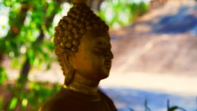 4K video of golden Buddha statue in Phra That Chom Wae temple, Thailand.