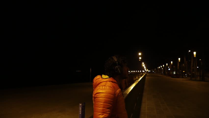 Man listening to music at night