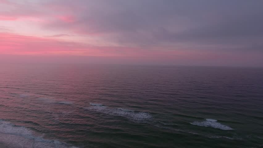Sun rise drone shot of ocean in Orange Beach Alabama