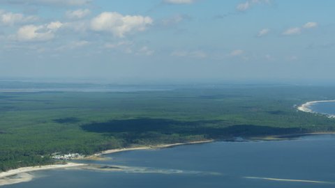 Aerial view of the Apalachicola national forest rural sweeping sandy coastline along the Florida Panhandle Gulf of Mexico America RED WEAPON
