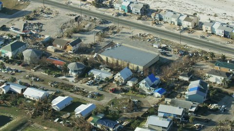 Aerial view of township destruction along Mexico beach tourist destination widespread property destruction from Hurricane Michael Landfall Florida Panhandle America RED WEAPON