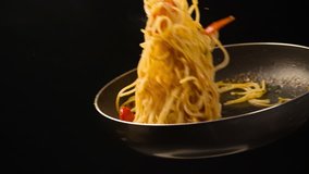 Cooking Pasta Spaghetti with tomatoes sauce tossing in Pan Slow motion video