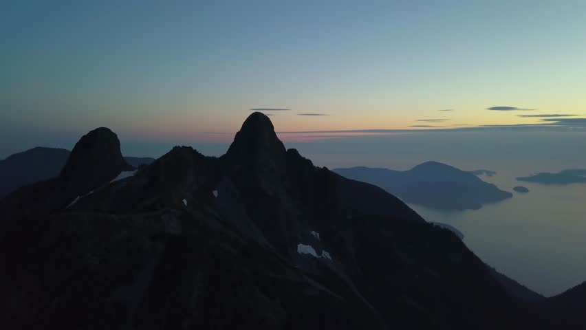 Aerial view of the Beautiful Canadian Mountain Landscape during a sunny summer sunset. Taken in Howe Sound, North of Vancouver, British Columbia, Canada.