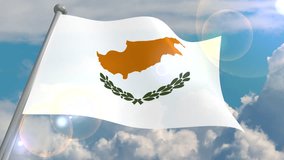 The flag of the Cyprus State of the island develops in the wind against a blue sky with cumulus clouds and a flash on the lens from the sun. 4K video is looped and decoded from a 3D program.