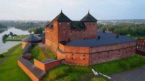 The old castle close-up, July morning. Hameenlinna, Finland (aerial video) 