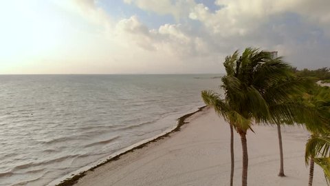 A tropical beach and ocean at sunrise near Cancun, Mexico.