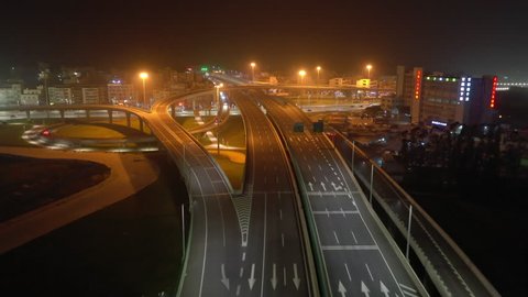 night illuminated zhuhai river traffic street road junction aerial panorama 4k china