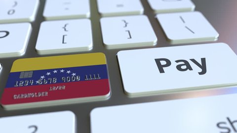 Bank card featuring flag of Venezuela as a key on a computer keyboard. Venezuelan online payment conceptual animation