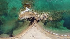Aerial drone video of tropical paradise deep turquoise mediterranean bay with sandy beach at sunset