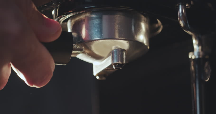 Pouring coffee stream from professional machine in cup. Barista man making double espresso, using filter holder. Flowing fresh ground coffee. Drinking roasted black coffee in the morning Royalty-Free Stock Footage #1025245037