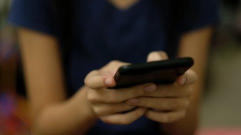 Teenager girl sending messages using smart phone