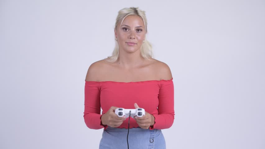 Happy young beautiful blonde woman playing games
