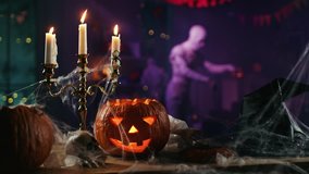 Halloween Still Life Colorful Theme: Scary Decorated Dark Room with Table Covered in Spider Webs, Burning Pumpkin, Candlestick, Witch's Hat and Skeleton.Background: Silhouette of Monster Walking By - Powered by Shutterstock - Get 15% off with code: PIKWIZARD15