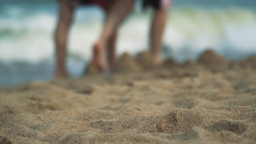Selective focus. Sandy beach and sea surf. | Shutterstock HD Video #1025266388