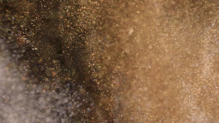 Elegant, detailed, and golden particles flow with shallow depth of field underwater | Shutterstock HD Video #1025272457