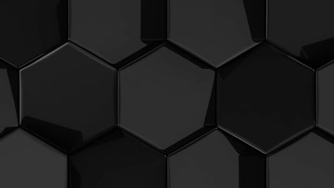 Black glossy animated moving hexagons with rounded edges. High quality seamless realistic video animation.