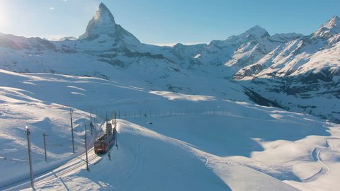 Matterhorn Mountain and Gornergrat Train in Winter at Sunset. Swiss Alps. Switzerland. Aerial View