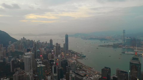 sunset time hong kong downtown district traffic harbour aerial panorama 4k