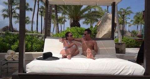 Couple Gets Drinks Delivered Poolside at Tropical Resort Pool