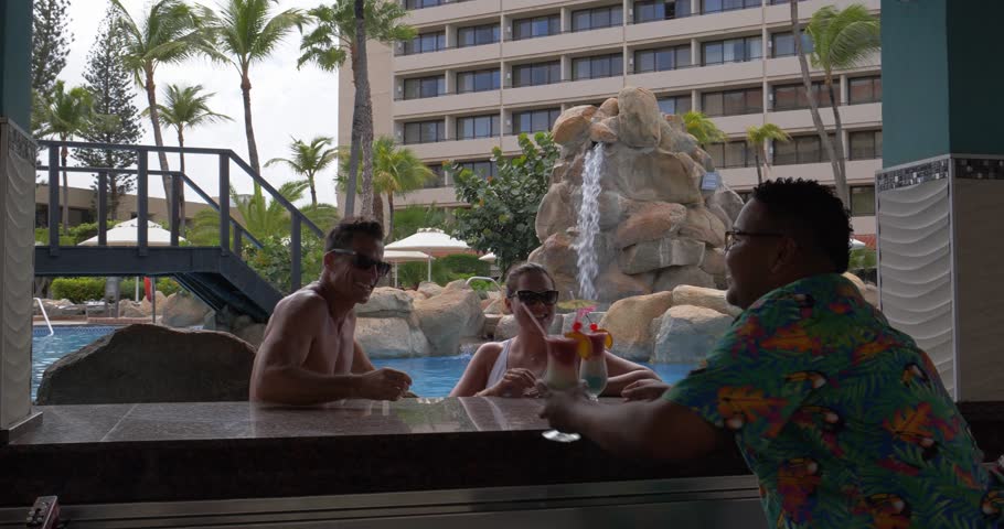 Bartender Serves Tropical Drinks at Pool Bar, Married Couple