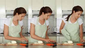 Young woman in apron dancing silly on kitchen with scapulas. Funny female enjoying herself moving ridiculously while preparing meal. Vertical video montage for mobile devices and social media